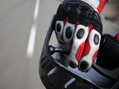 Motorcycle glove on handlebar